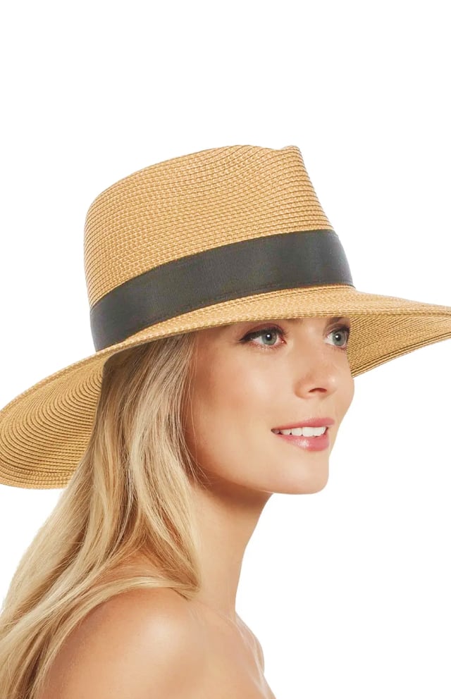 Lack of specific brand or model details prevents exact alt text per rules; suggest: "Straw wide-brim hat with black band made from woven natural fibers"