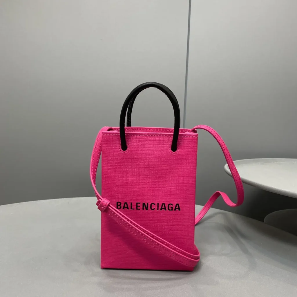 Balenciaga Shopping Phone Bag mini pink saffiano leather tote with black handles and adjustable strap