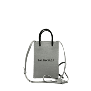 Mini Grey Balenciaga crossbody bag made of luxurious calf leather, featuring iconic logo, trendy design, and stylish shoulder strap.