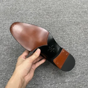 Louis Vuitton dress shoe sole brown black leather size 7 with metal heel studs and logo embossment