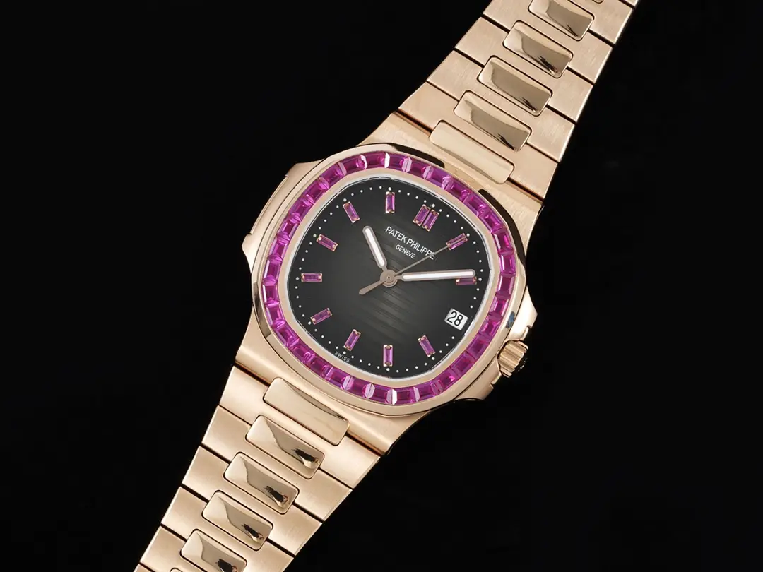 Patek Philippe Nautilus black dial pink sapphire bezel rose gold case and bracelet watch
