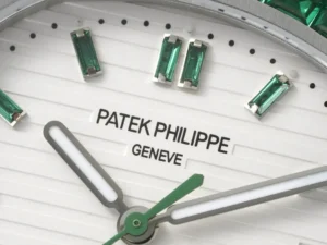 Patek Philippe Nautilus white dial green baguette hour markers stainless steel watch close-up