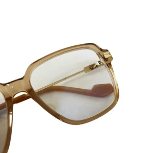 Gentle Monster Jef sunglasses with transparent lenses and a stylish gold frame, showcasing the design and quality relevant to the e-commerce product listing.