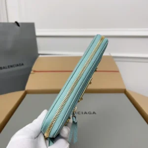 Balenciaga Lake Water Green Classic Retro Zipper wallet showcasing side view with gold zipper detail, displayed on a neutral background.