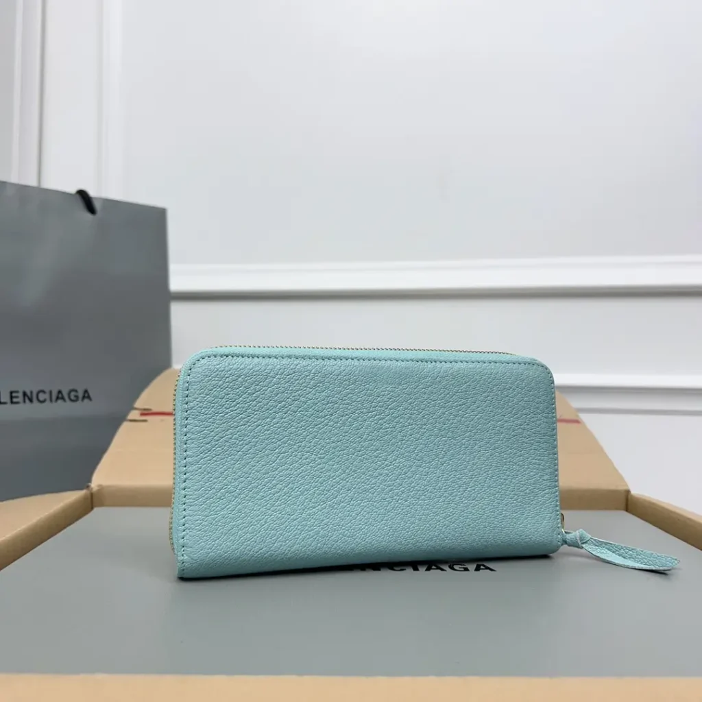 Balenciaga zip-around wallet light blue pebbled leather compact design with wrist strap