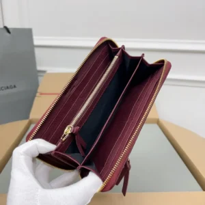 Balenciaga zip-around wallet burgundy leather gold zipper multiple card slots interior compartments