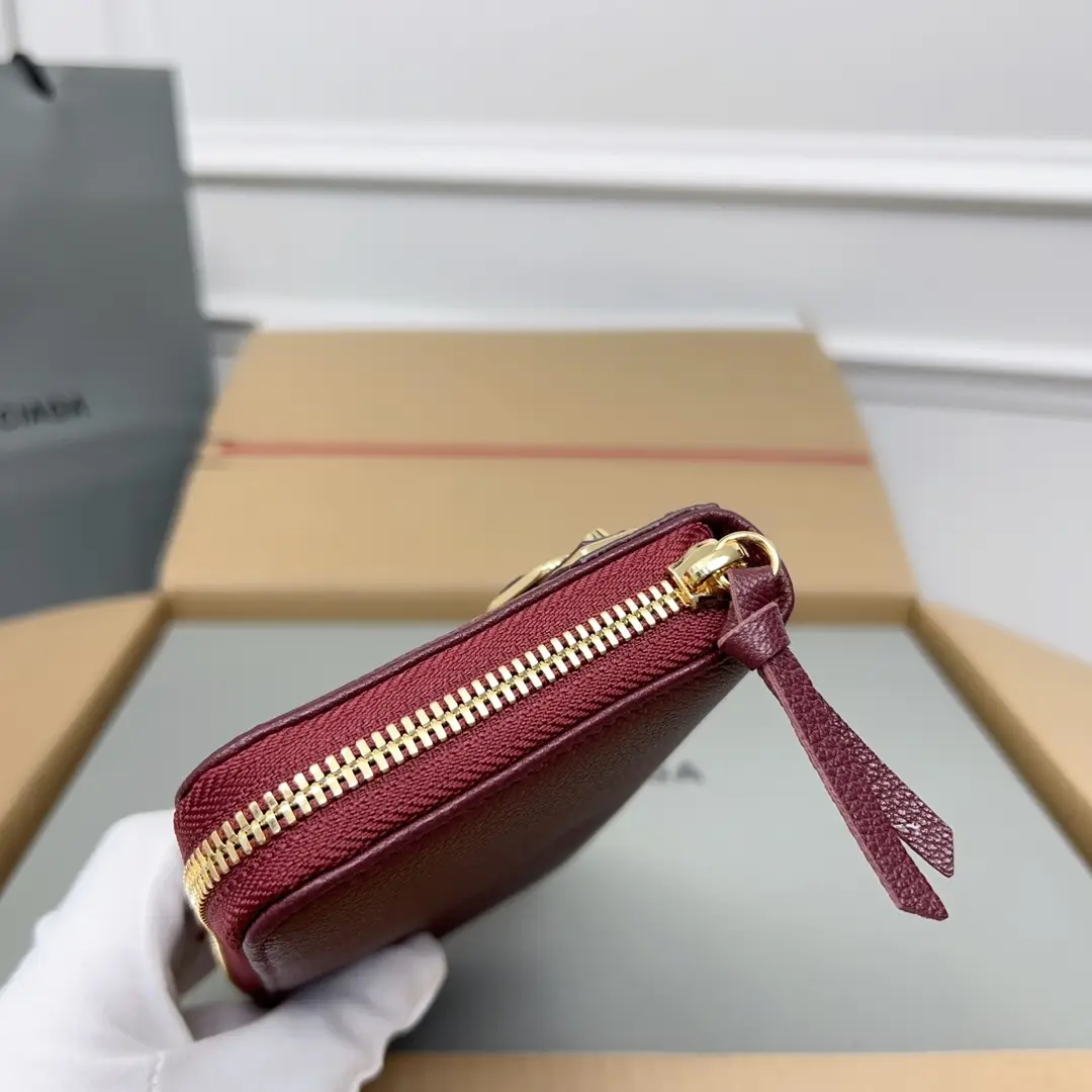 Prada zip-around wallet small size burgundy leather gold-tone zipper and pull