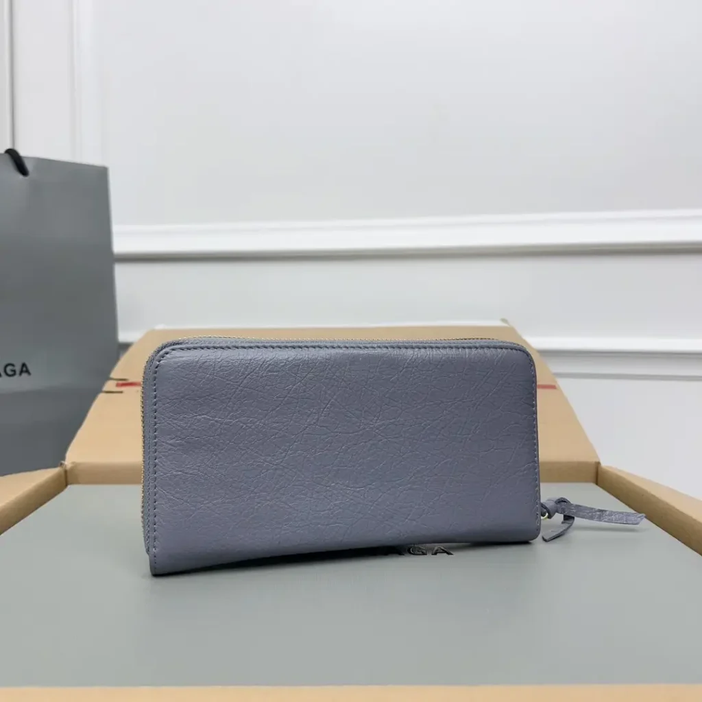 Balenciaga zip-around wallet light blue textured leather with leather pull tab accessory