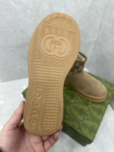 Gucci ankle boots tan suede with brown GG canvas upper and rubber sole detailed with Gucci logo