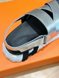 Hermes sandal silver leather strap black footbed white rubber sole slip-on sandal