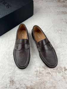 Dior Men's Boutique Le Fu Shoes in dark brown leather, showcasing stylish urban design and craftsmanship, with a branded box in the background.