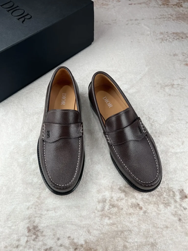 Dior loafers leather dress shoes dark brown pebbled leather with Dior box on carpet background