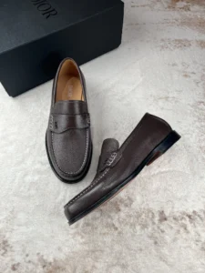 Dior Men's Boutique Le Fu Shoes in dark brown leather, showcasing luxury craftsmanship and urban style, with a black box in the background.