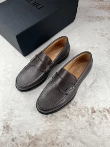 Dior Men's Boutique Le Fu Shoes in dark brown leather with a sleek design, displayed alongside a branded box, emphasizing luxury and urban style.