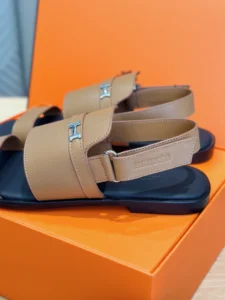 Hermès Oran sandals beige leather slingback flat sandals with silver H buckle on orange box