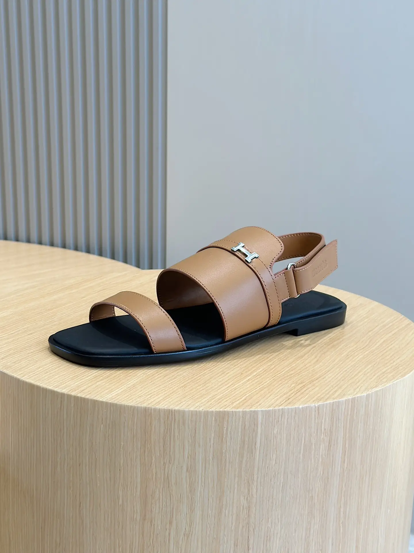 Hermès Oran sandal tan leather silver H logo flat sandal black sole