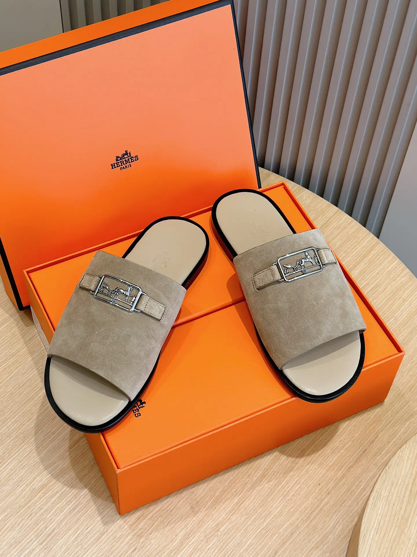 Hermes Oran slide sandals taupe beige suede leather with silver-tone hardware on orange box