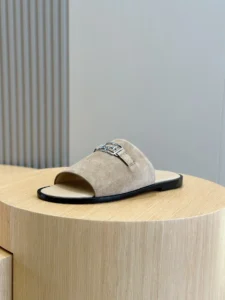 Hermes Oran slide sandals beige suede leather with silver buckle detail and black sole