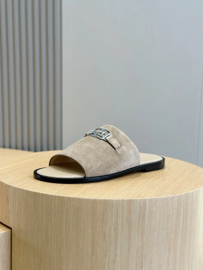 Hermes Oran slide sandals beige suede leather with silver buckle detail and black sole