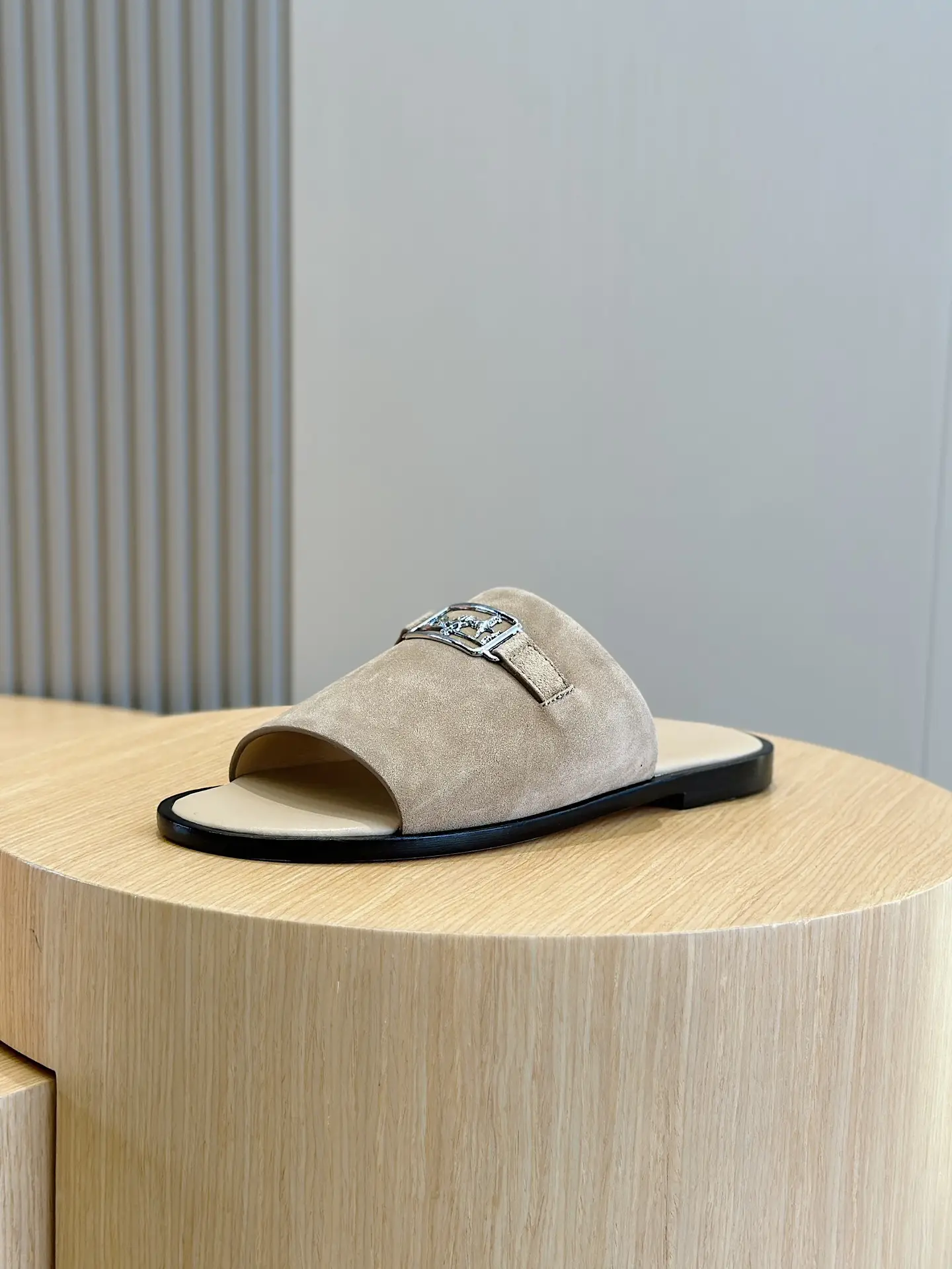 Hermes Oran slide sandals beige suede leather with silver buckle detail and black sole