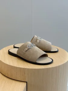 Hermès Oran sandals beige suede leather slides with silver horsebit buckle detail