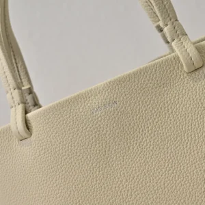 The Row Park tote in soft lychee patterned cowhide with minimalist design and durable handles.
