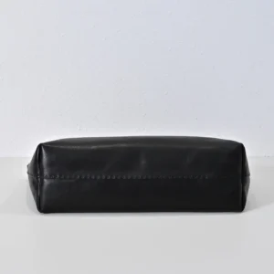 Black leather bottom view of the Therow Nuance Sheepskin Tote Bag, showcasing minimalist design and luxurious lambskin material.