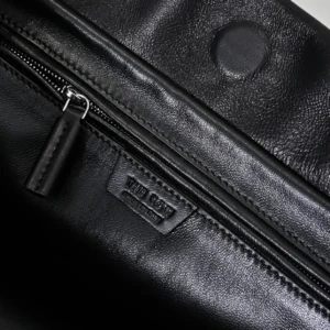 Close-up of the interior of the Therow Nuance Sheepskin Tote Bag, featuring a zipper, soft lambskin material, and minimalist design elements.