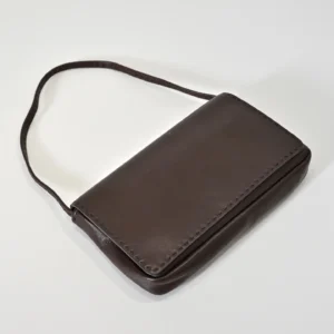 Therow Nuance Sheepskin Tote Bag in dark brown leather, showcasing minimalist design and a sleek silhouette, ideal for low-key luxury appeal.