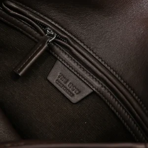 Interior view of Therow Nuance Sheepskin Tote Bag showcasing zipper and brand tag, emphasizing luxurious materials and minimalist design.