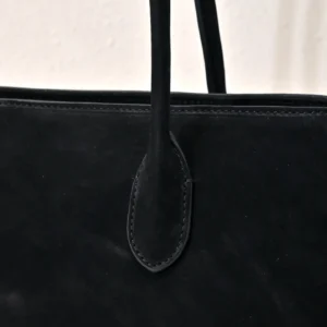 Saint Laurent Sac De Jour small tote bag black suede leather handles close-up detail