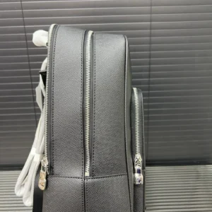 Louis Vuitton printed backpack showcasing dual zippers and textured black material, ideal for budget-conscious luxury fashion enthusiasts.