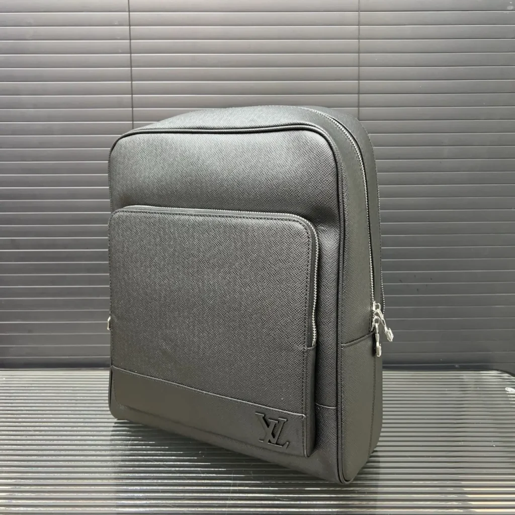 Louis Vuitton backpack medium size black textured leather bag with front zip pocket and LV logo