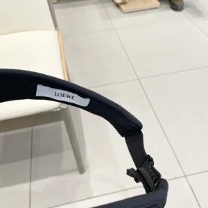 Loewe accessory black fabric adjustable strap with white brand label and textured detailing