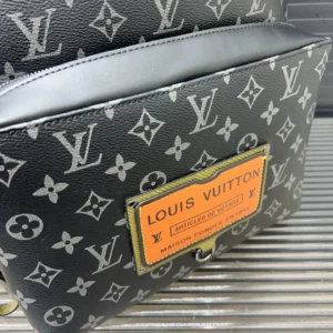 Louis Vuitton Discovery Backpack 40 black monogram canvas bag with orange patch and leather trim