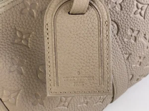 Louis Vuitton Keepall 55 M41414 taupe textured monogram leather duffle bag with luggage tag