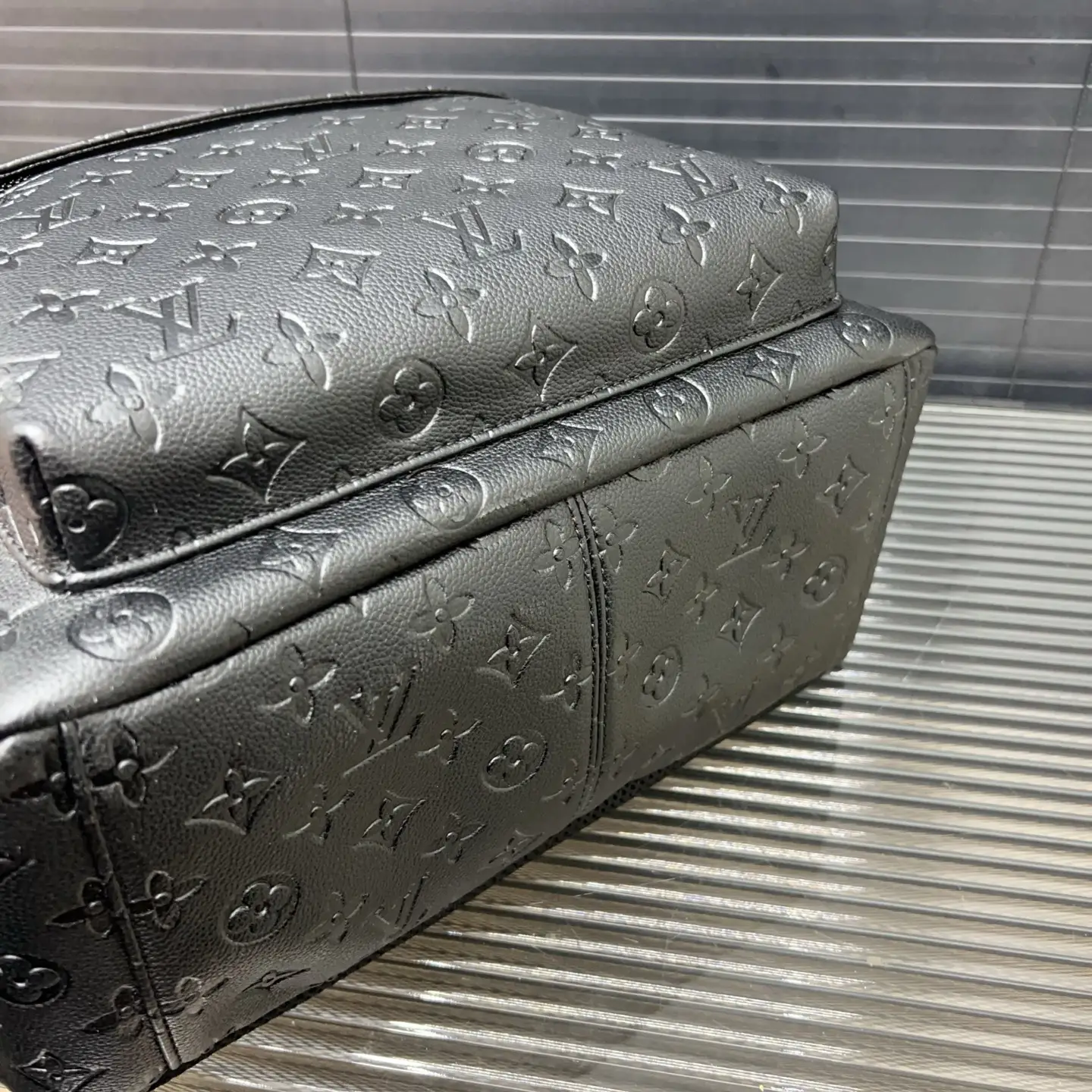 Louis Vuitton Discovery Backpack small black embossed leather bag luxury monogram design