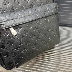 Louis Vuitton Discovery Messenger GM black embossed monogram leather bag with silver buckle detail
