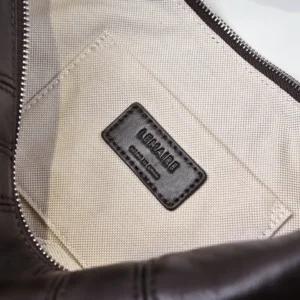 Lemaire leather bag interior beige canvas lining with black leather brand label and silver zipper details