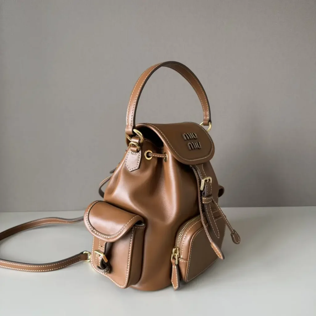 Miu Miu Mini Leather Backpack brown calf leather bag with front pockets and top handle