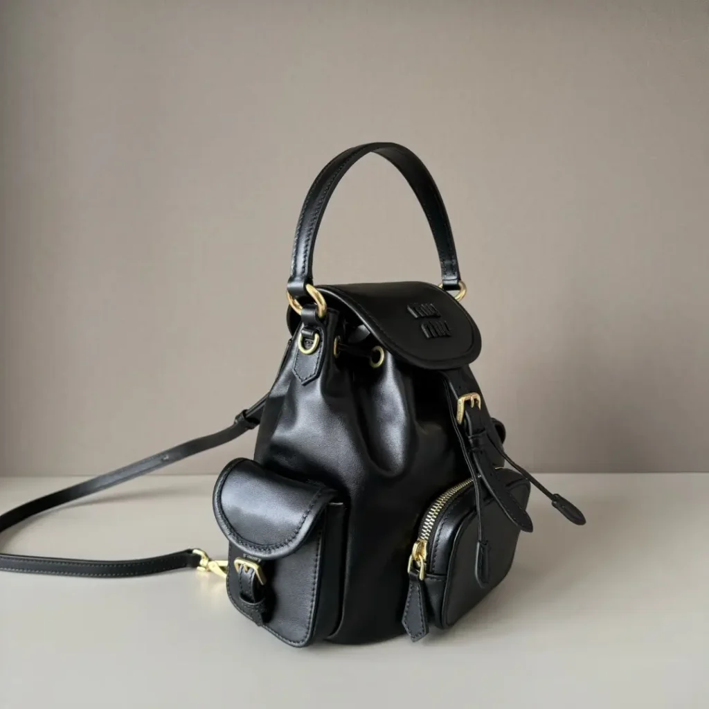 Miu Miu mini backpack black calf leather bag with front pockets and gold hardware