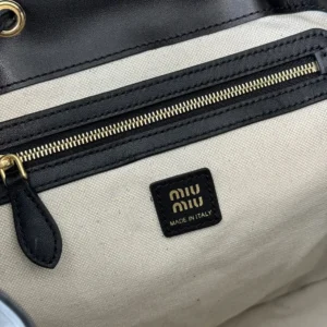 Miu Miu handbag interior beige canvas black leather trim gold zipper made in Italy label