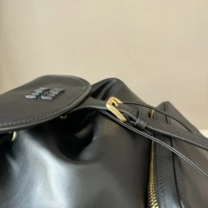 Miu Miu backpack medium black calf leather bag with gold-tone buckle and zipper details