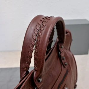 Balenciaga City medium 503739 brown leather satchel bag with woven handle detail and silver hardware