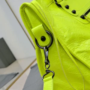 Balenciaga Motorcycle City S neon yellow distressed leather medium handbag with black hardware strap clip