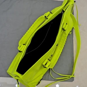 Balenciaga Classic City bag medium yellow neon distressed leather with zippered closure and handles