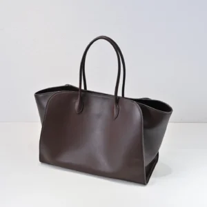 The Row Marlo Tote in black, showcasing a sleek, minimalist design with durable leather and spacious interior, ideal for luxury accessory shoppers.