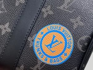 Louis Vuitton trunk and bag monogram canvas logo patch with black leather strap detail