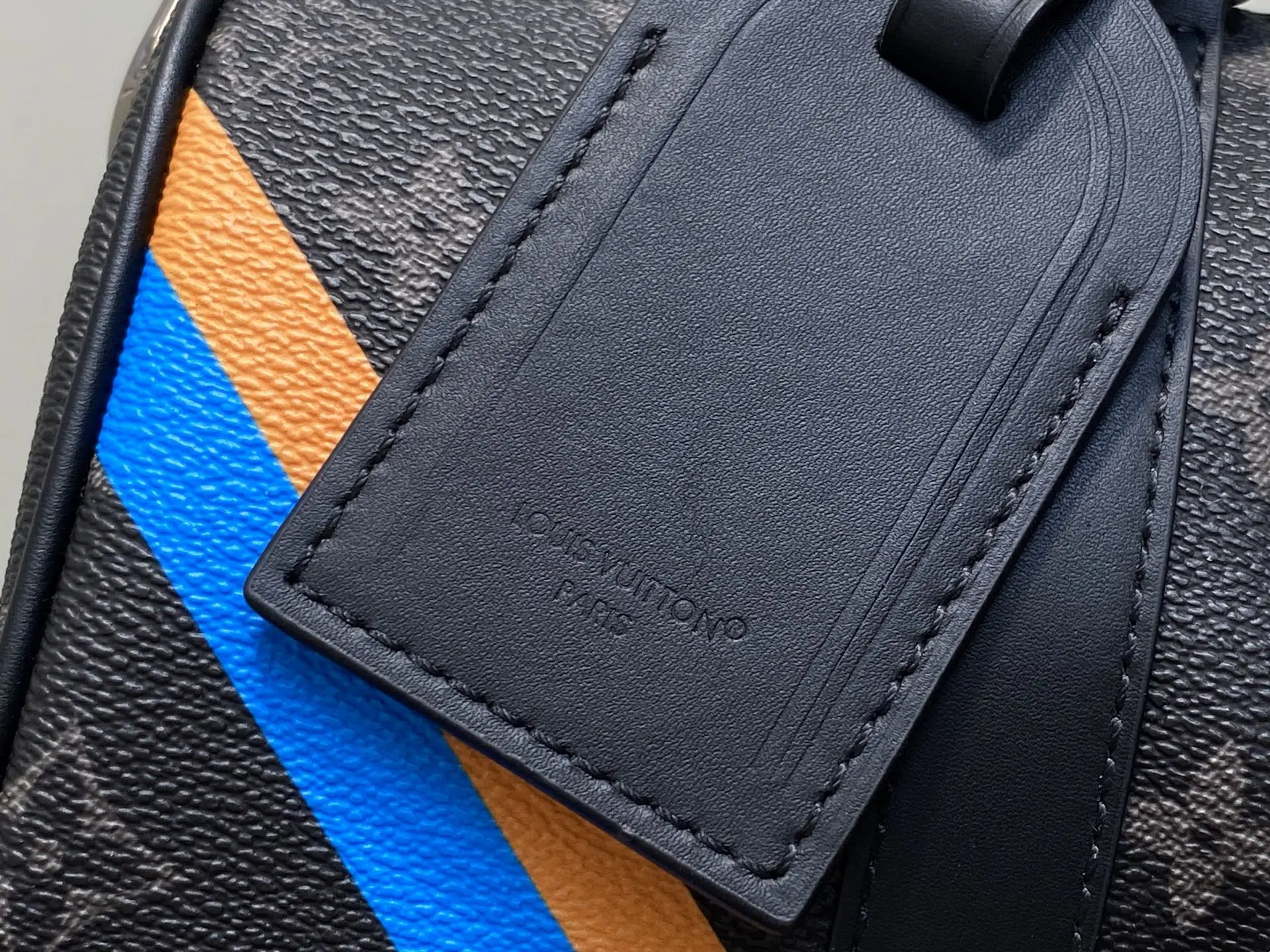 Louis Vuitton Keepall 55 M41414 monogram canvas duffle bag with blue and orange stripes and black leather tag