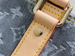 Louis Vuitton Keepall bag natural leather strap yellow stitching silver rivet durable canvas material